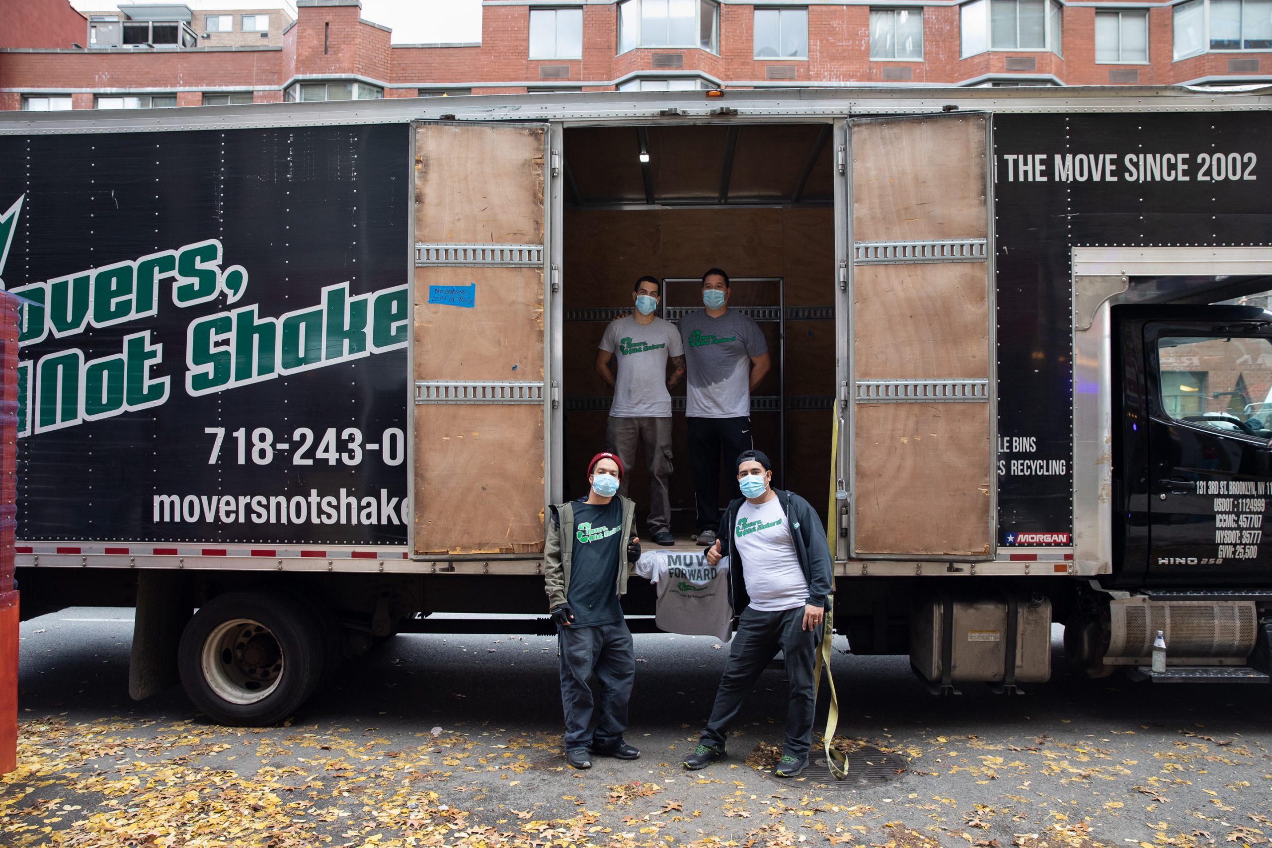 Nolita movers in front of a Movers Not Shakers truck