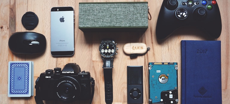 different types of electronics on a wooden table