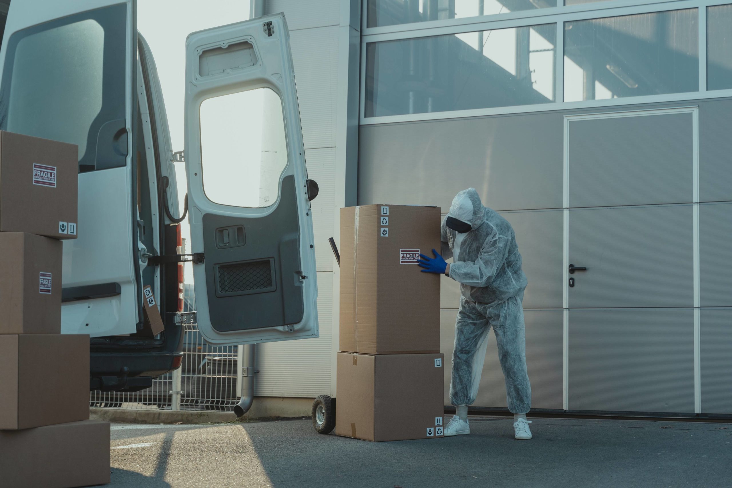 A man stacking boxes onto quality moving equipment