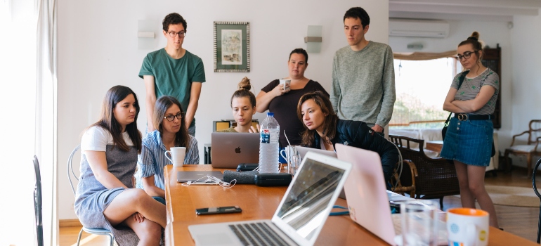 young professionals having a meeting in an open plan office in NYC