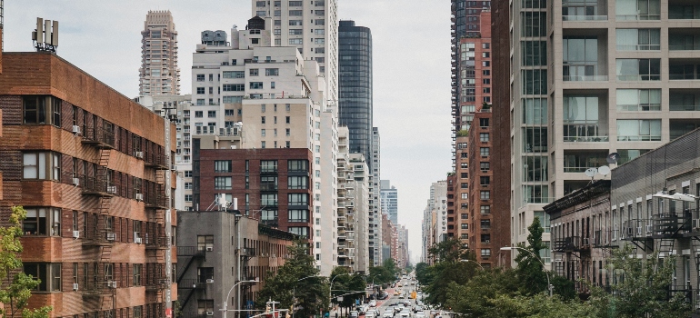 Residential buildings and a busy street of one of Brooklyn neighborhoods for first-time homebuyers