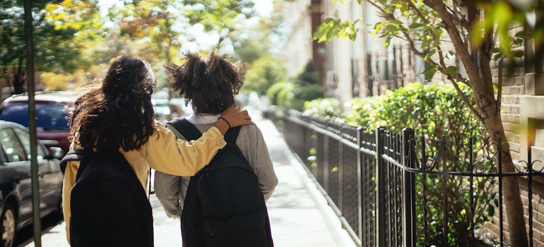 two school girls walking the street