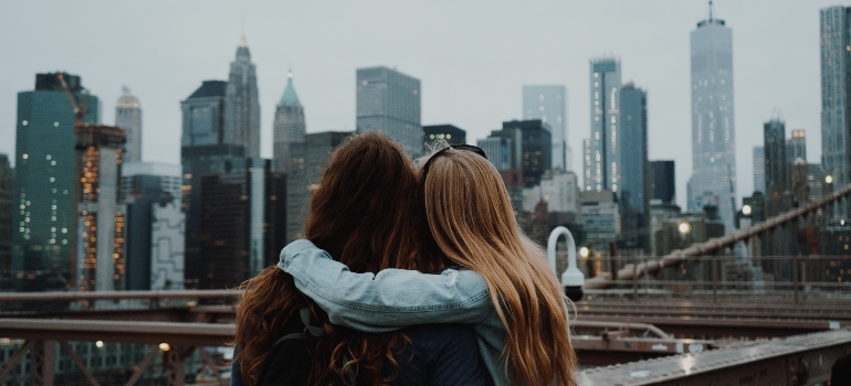 Two women hugging each other