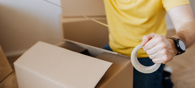 A man packing a box