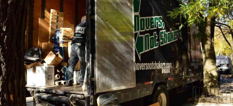 movers in a moving truck loading the boxes