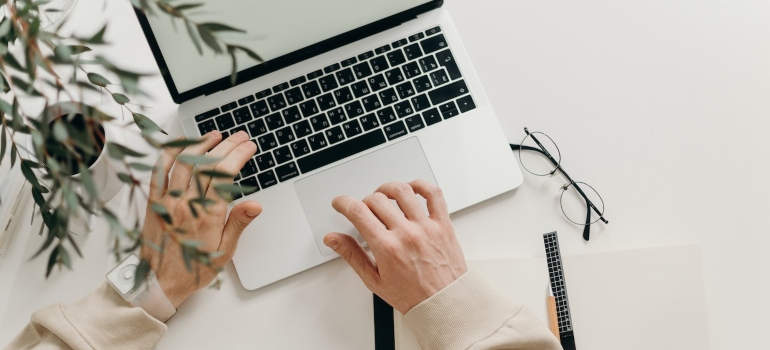 a person typing on a laptop