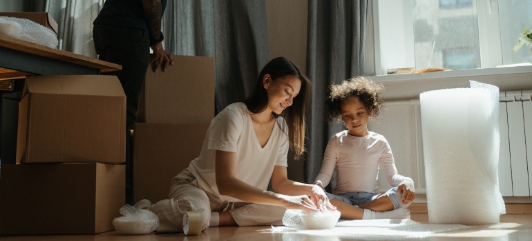 a mother and daughter packing