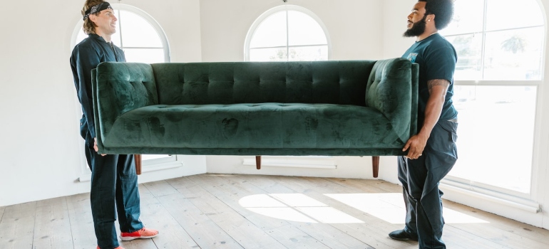 movers lifting a sofa 