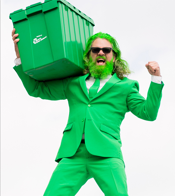 a green-bearded man all dressed up in green carrying a reusable moving bin