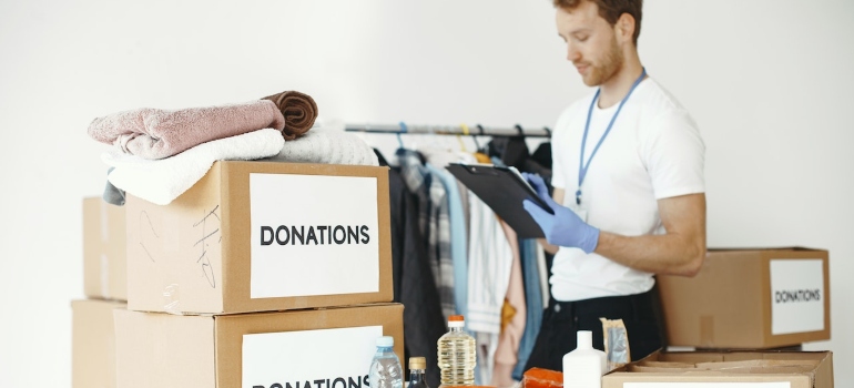 a man with an inventory list trying to declutter in a green way