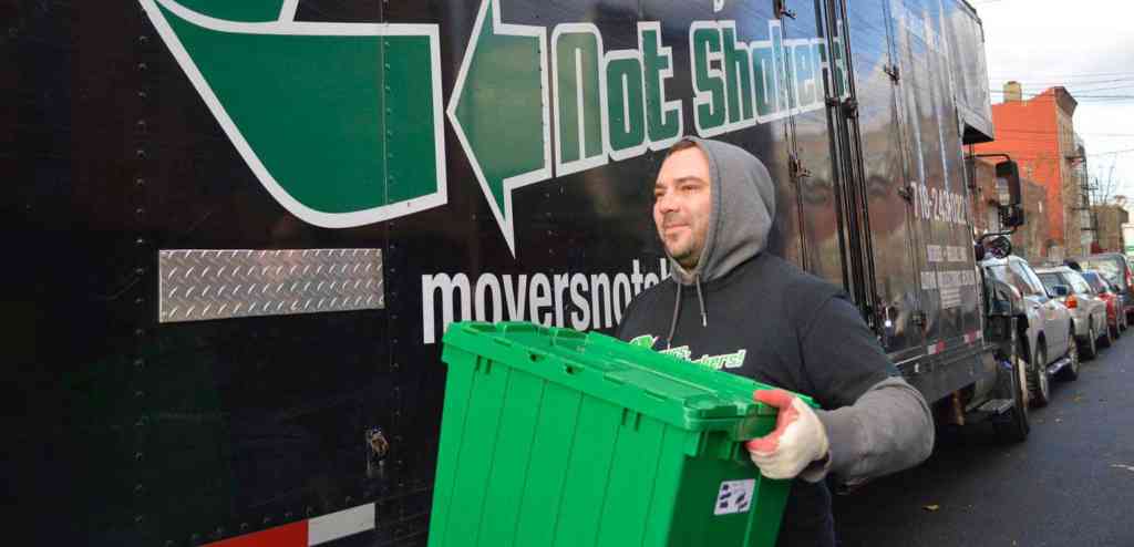 a mover holding a reusable moving bin
