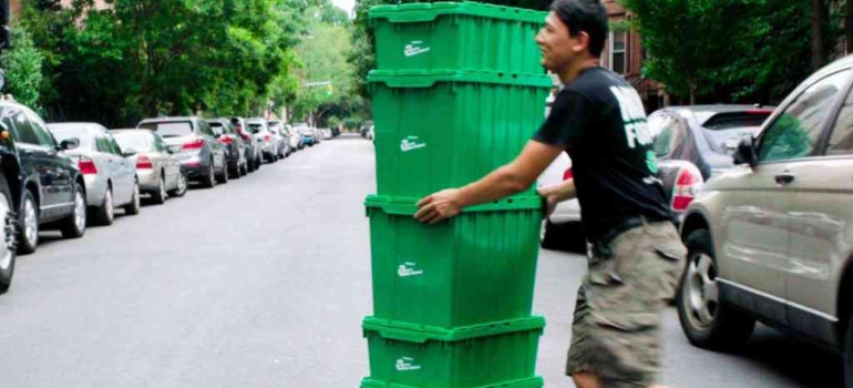 one of the Borough park movers with reusable moving bins on a dolly
