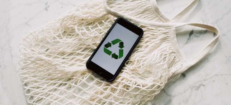 a recycle sign on a telephone